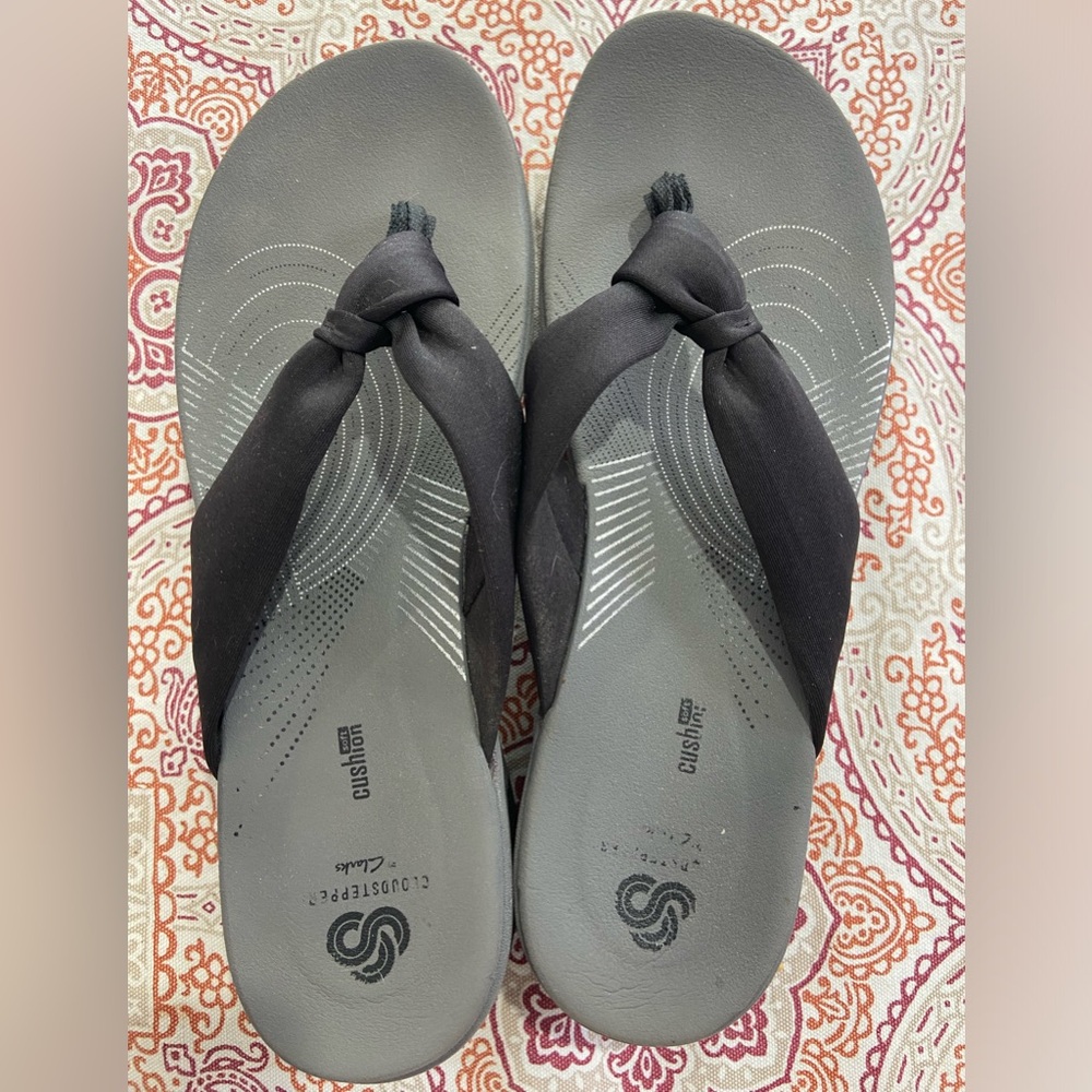 Black Clark’s flip flops
